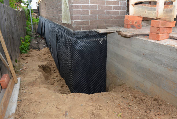 SJ Waterproofing Pros technician performing targeted Waterproofing assessment in Spencer, NC